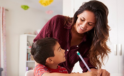Mother and son doing homework together