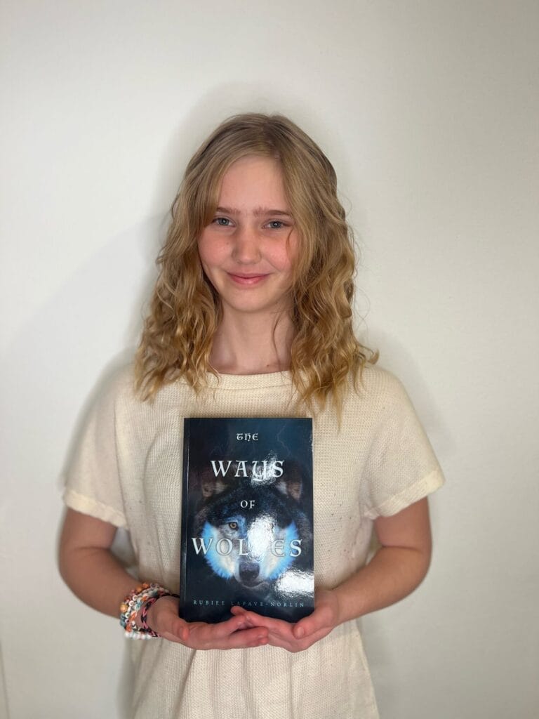 Rubie holding the book